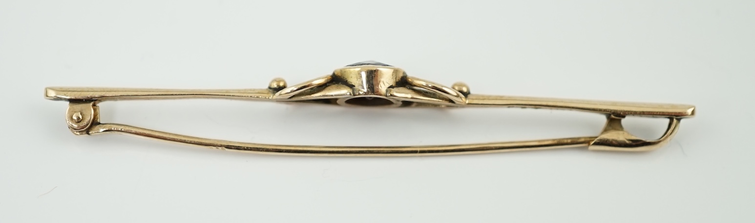 A late 19th century Russian August Wilhelm Holstrom for Faberge 56 zolotnik gold and single stone garnet set bar brooch
